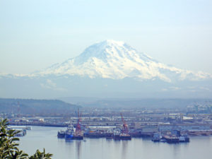 Mt. Rainer serves as a backdrop to the port at Tacoma, Washington